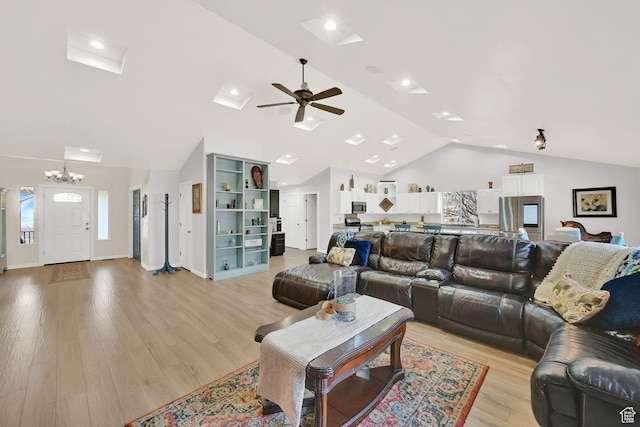 654 E 3225 N, North Ogden, UT 84414 - living area featuring lofted ceiling, light wood-style flooring, and ceiling fan with notable chandelier