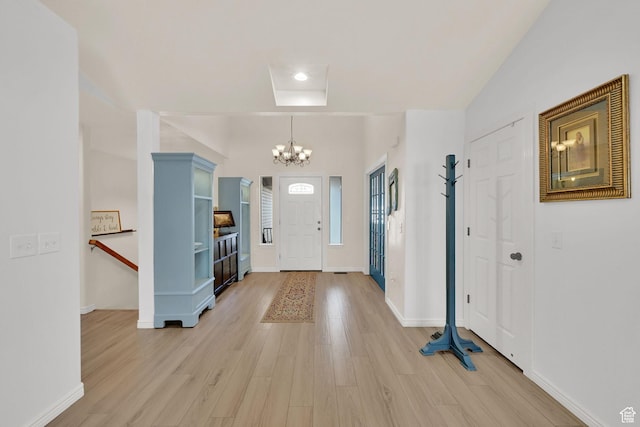 654 E 3225 N, North Ogden, UT 84414 - entrance foyer featuring light wood-type flooring, a notable chandelier, and baseboards