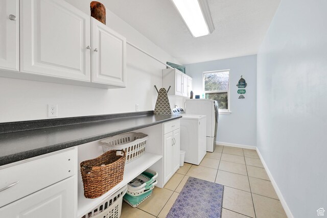 654 E 3225 N, North Ogden, UT 84414 - clothes washing area with cabinet space, light tile patterned floors, baseboards, and separate washer and dryer