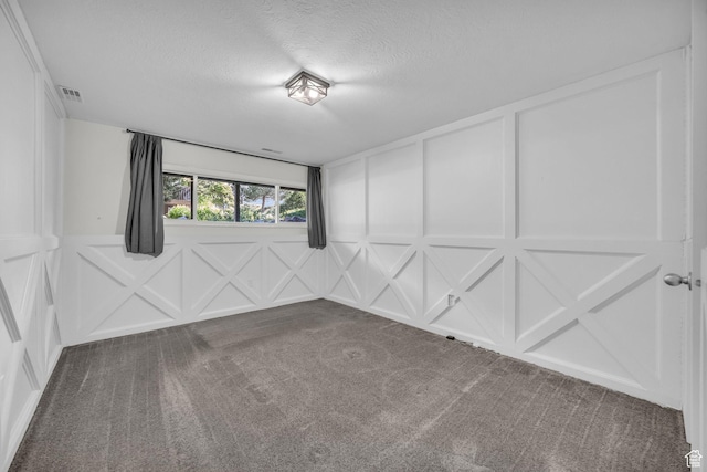1384 Millcreek Dr Unit 6, Ogden, UT 84404 - carpeted empty room featuring a textured ceiling, visible vents, and a decorative wall