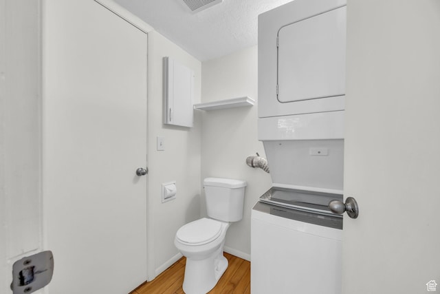 1384 Millcreek Dr Unit 6, Ogden, UT 84404 - bathroom with a textured ceiling, baseboards, toilet, visible vents, and wood finished floors