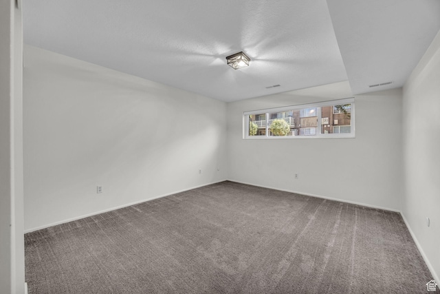 1384 Millcreek Dr Unit 6, Ogden, UT 84404 - unfurnished room featuring baseboards, carpet flooring, visible vents, and a textured ceiling