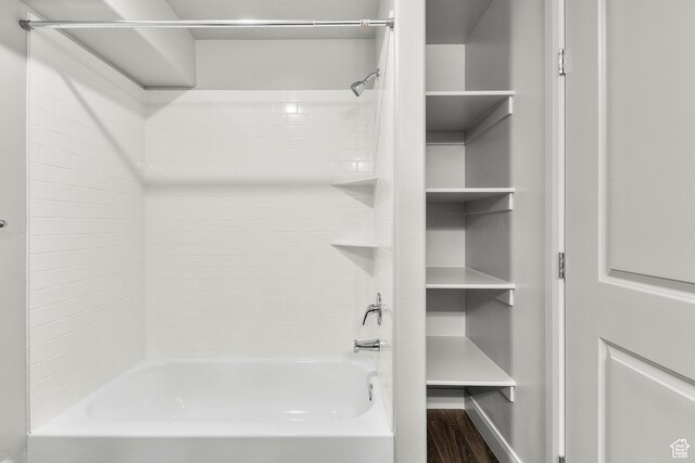 128 N Lone Rock Dr Unit 202, Hurricane, UT 84737 - bathroom with washtub / shower combination and wood finished floors