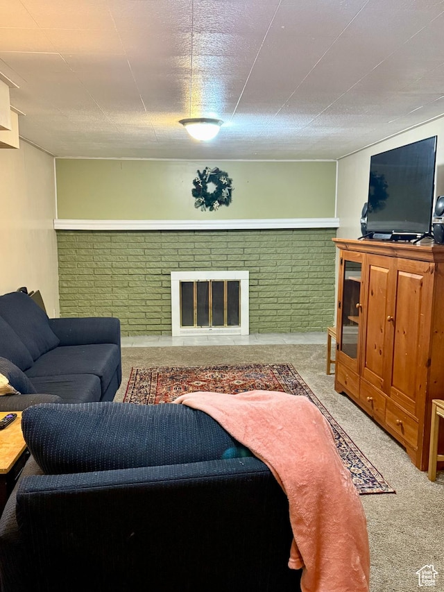 carpeted living room with a brick fireplace