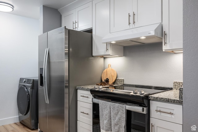kitchen featuring appliances with stainless steel finishes, washer / dryer, under cabinet range hood, light wood-style flooring, and white cabinetry
