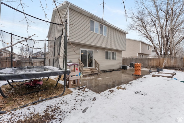 74 E Horizon Ave S, Heber City, UT 84032 - snow covered property featuring a trampoline, entry steps, central AC, and a fenced backyard
