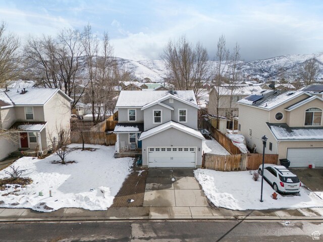 74 E Horizon Ave S, Heber City, UT 84032 - traditional-style house with a residential view, concrete driveway, fence, and an attached garage