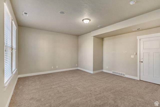1972 Grant Ave, Ogden, UT 84401 - carpeted empty room featuring visible vents and baseboards
