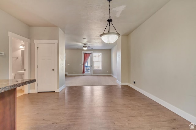 1972 Grant Ave, Ogden, UT 84401 - unfurnished dining area with wood finished floors, baseboards, and ceiling fan