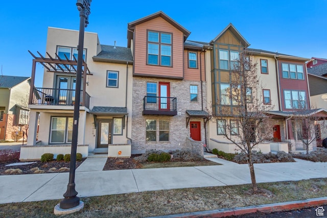 1972 Grant Ave, Ogden, UT 84401 - townhome / multi-family property featuring stucco siding and a pergola