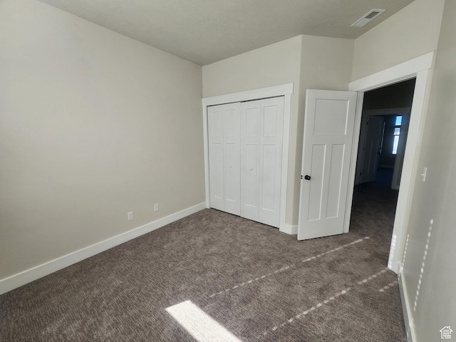 1972 Grant Ave, Ogden, UT 84401 - unfurnished bedroom featuring visible vents, baseboards, carpet, and a closet