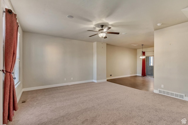1972 Grant Ave, Ogden, UT 84401 - carpeted spare room featuring visible vents, baseboards, and ceiling fan