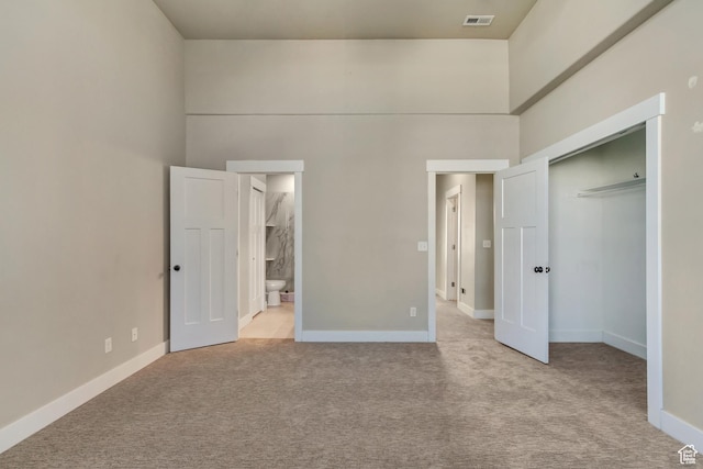 1972 Grant Ave, Ogden, UT 84401 - unfurnished bedroom featuring visible vents, carpet floors, baseboards, and a towering ceiling