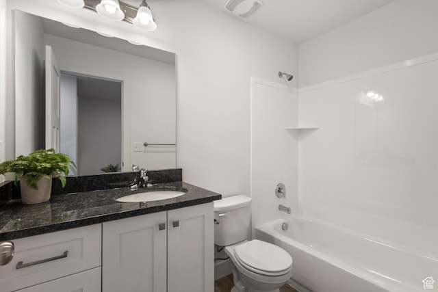 bathroom with toilet, visible vents, shower / tub combination, and vanity
