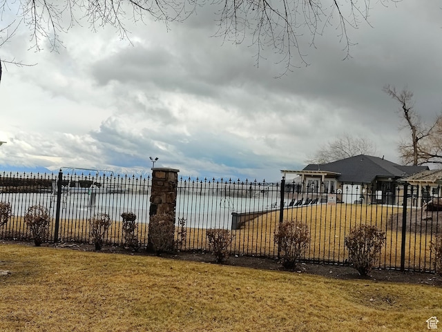 75 E Redwing Ct, Saratoga Springs, UT 84045 - view of gate featuring a lawn, a water view, and fence