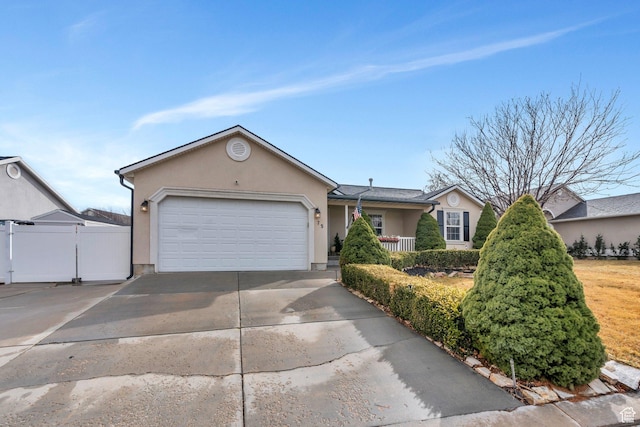 75 E Redwing Ct, Saratoga Springs, UT 84045 - ranch-style home featuring concrete driveway, fence, an attached garage, and stucco siding