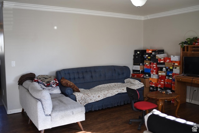 living room with crown molding, baseboards, and wood finished floors