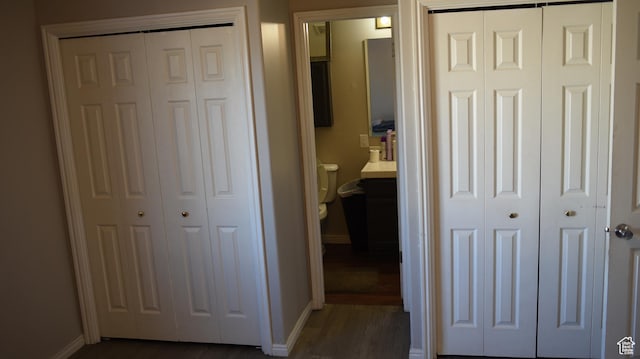 interior space featuring dark wood-style floors and baseboards