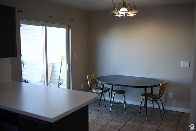 dining room with baseboards, an inviting chandelier, and light tile patterned floors