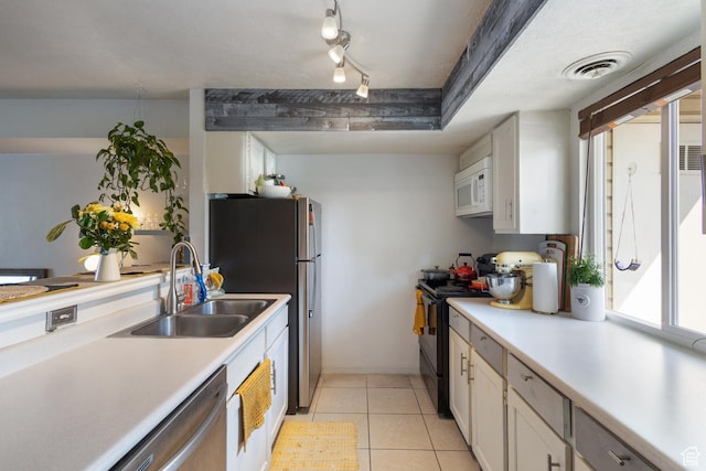 5354 S Baldwin Park, Murray, UT 84123 - kitchen with stainless steel appliances, light countertops, a sink, and visible vents