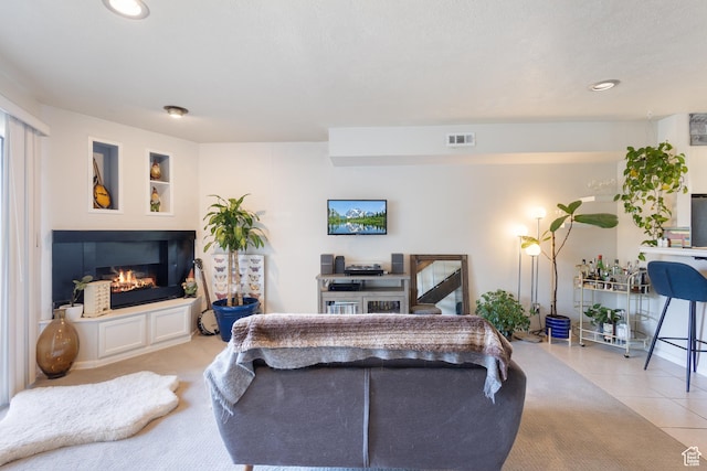 5354 S Baldwin Park, Murray, UT 84123 - living room with light tile patterned floors, a glass covered fireplace, visible vents, and recessed lighting