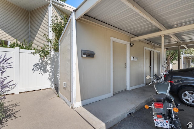 5354 S Baldwin Park, Murray, UT 84123 - view of exterior entry featuring an attached carport and fence