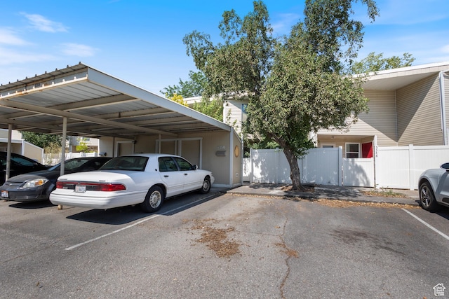 5354 S Baldwin Park, Murray, UT 84123 - partially covered parking lot featuring fence and a gate