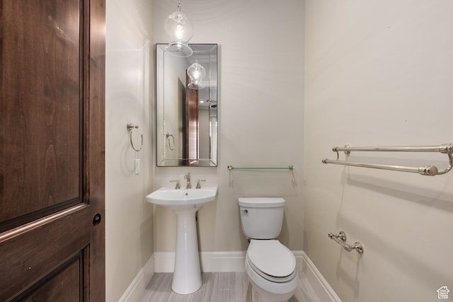 2950 S Old Farm Rd, Washington, UT 84780 - bathroom featuring toilet and baseboards