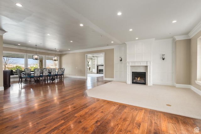 2950 S Old Farm Rd, Washington, UT 84780 - living area featuring baseboards, a fireplace, hardwood / wood-style flooring, and crown molding