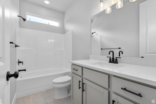 full bathroom with tile patterned flooring, bathtub / shower combination, vanity, and toilet