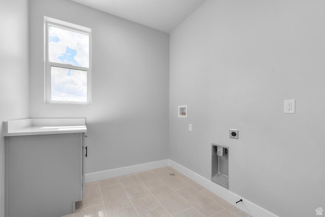 laundry area featuring laundry area, baseboards, hookup for a washing machine, electric dryer hookup, and light tile patterned flooring