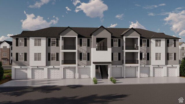 view of property with an attached garage and a residential view