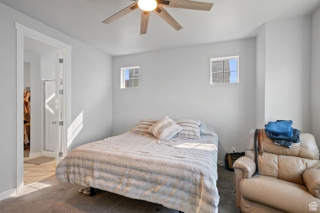 5715 Brambling Way E, Stansbury Park, UT 84074 - carpeted bedroom with a ceiling fan