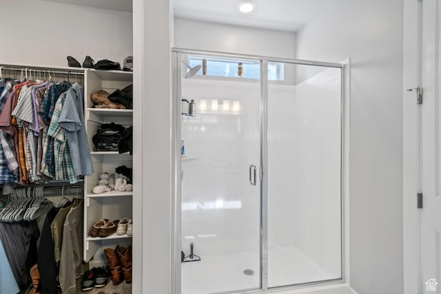 5715 Brambling Way E, Stansbury Park, UT 84074 - bathroom featuring a shower stall and a walk in closet