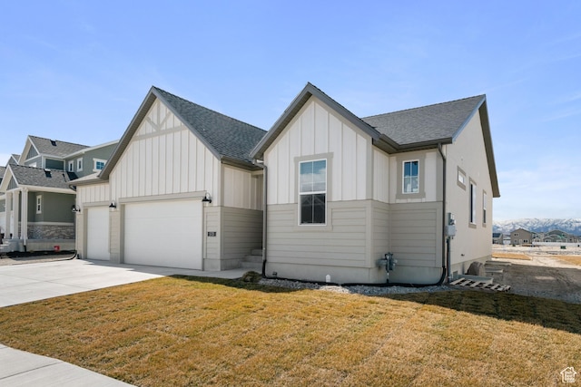 modern farmhouse style home with a garage, a shingled roof, concrete driveway, board and batten siding, and a front yard
