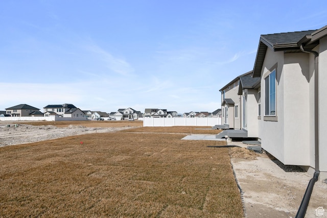5715 Brambling Way E, Stansbury Park, UT 84074 - view of yard with fence and a residential view