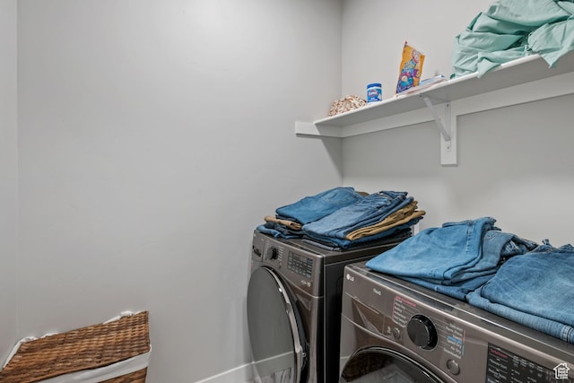 5715 Brambling Way E, Stansbury Park, UT 84074 - washroom with washing machine and clothes dryer, baseboards, and laundry area