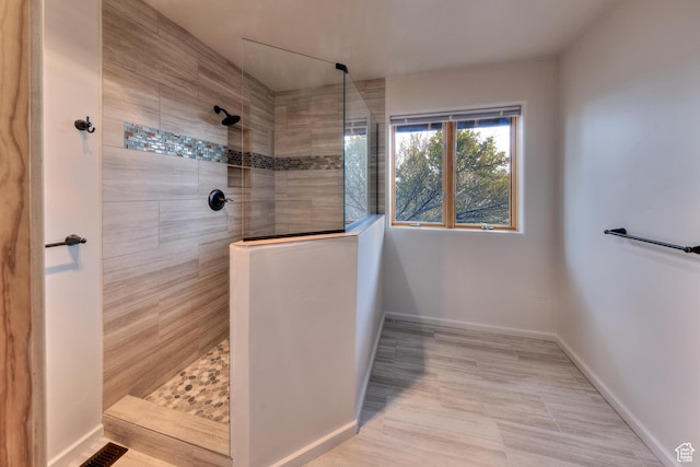 27 Behind The Rocks Dr, Moab, UT 84532 - bathroom featuring visible vents, baseboards, and walk in shower