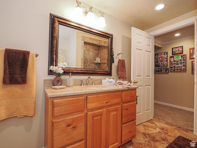 121 E Amber Rd, Saratoga Springs, UT 84045 - bathroom featuring vanity, stone finish floors, recessed lighting, baseboards, and ornamental molding
