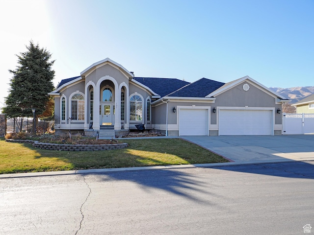 121 E Amber Rd, Saratoga Springs, UT 84045 - view of front of property with a garage, stucco siding, and concrete driveway