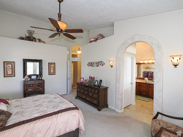 121 E Amber Rd, Saratoga Springs, UT 84045 - carpeted bedroom with arched walkways, lofted ceiling, ensuite bathroom, baseboards, and a ceiling fan