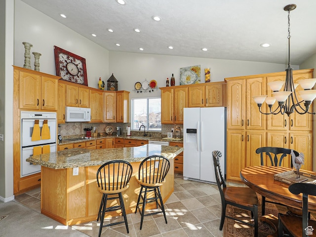 121 E Amber Rd, Saratoga Springs, UT 84045 - kitchen with white appliances, a center island, a chandelier, recessed lighting, and backsplash