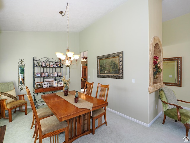 121 E Amber Rd, Saratoga Springs, UT 84045 - dining space with a chandelier, light carpet, baseboards, and vaulted ceiling