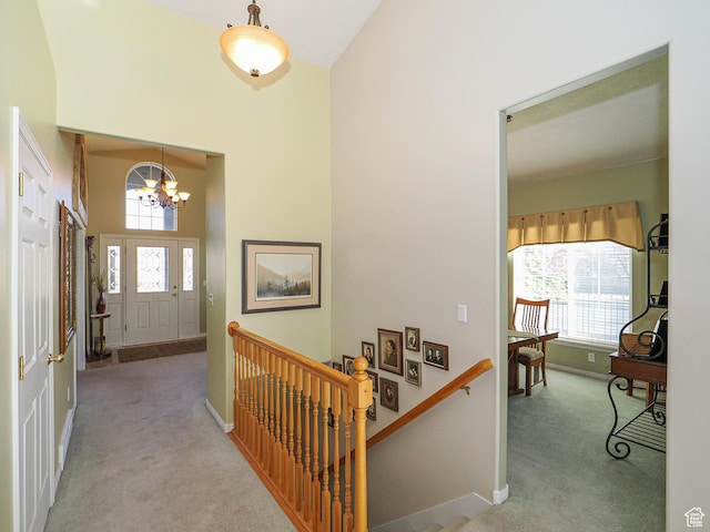 121 E Amber Rd, Saratoga Springs, UT 84045 - foyer entrance featuring carpet floors, a chandelier, baseboards, and a towering ceiling