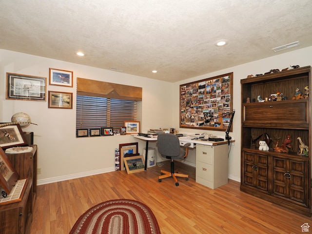121 E Amber Rd, Saratoga Springs, UT 84045 - office featuring a textured ceiling, baseboards, light wood-type flooring, recessed lighting, and built in desk