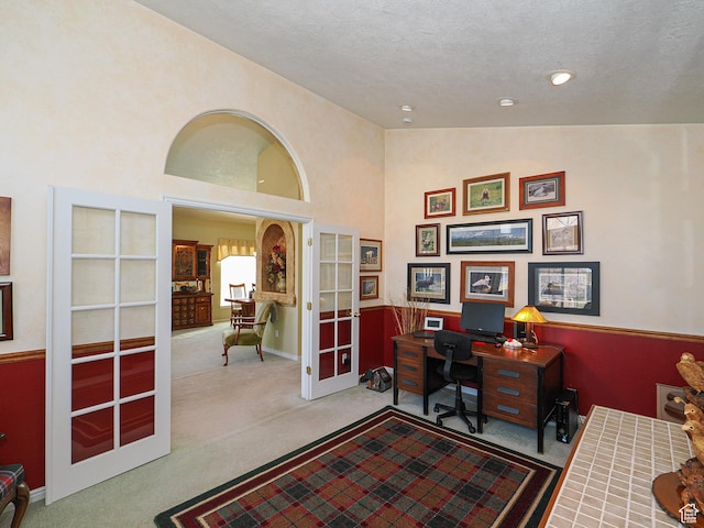 121 E Amber Rd, Saratoga Springs, UT 84045 - office area featuring french doors, carpet flooring, high vaulted ceiling, and a textured ceiling