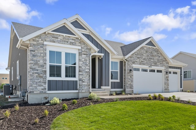 6453 W Barneys Creek Way, West Jordan, UT 84081 - craftsman-style house featuring stone siding, board and batten siding, and an attached garage