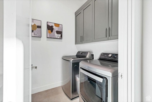 1478 W Torrey Rd, Hurricane, UT 84737 - laundry area with washing machine and dryer, cabinet space, baseboards, and light tile patterned flooring