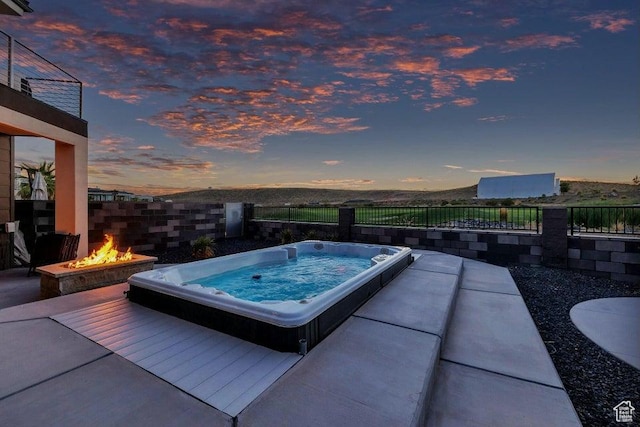 1478 W Torrey Rd, Hurricane, UT 84737 - view of pool with hot tub deck surround, a fire pit, and fence