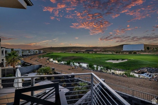 1478 W Torrey Rd, Hurricane, UT 84737 - balcony at dusk featuring a water view and view of golf course